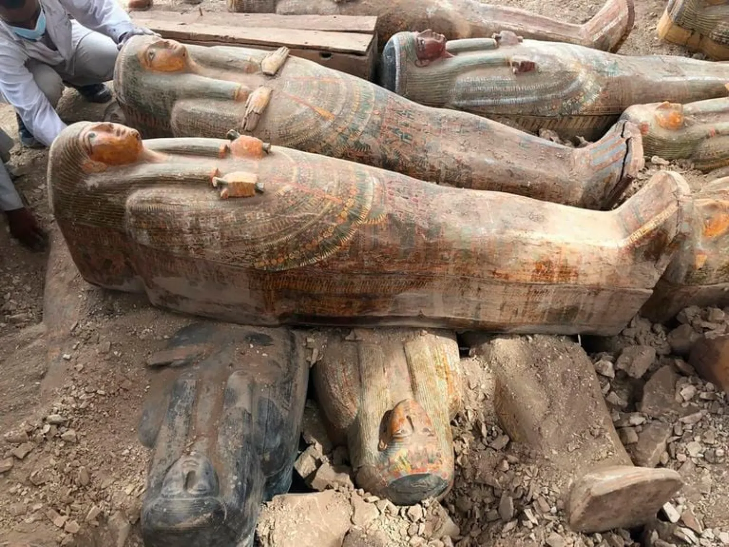 This photo provided by the Egyptian Ministry of Antiquities shows recently discovered ancient colored coffins with inscriptions and paintings, in the southern city of Luxor, Egypt, Tuesday, Oct. 15, 2019. (Egyptian Ministry of Antiquities via AP)