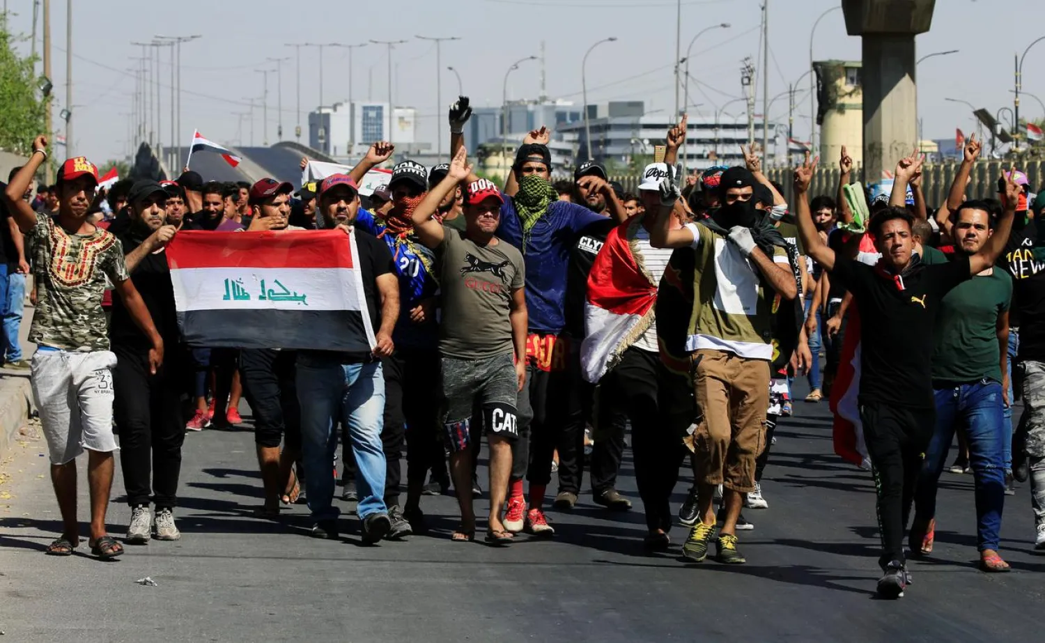 Demonstrators gesture at a protest during a curfew, three days after the nationwide anti-government protests turned violent, in Baghdad, Iraq October 4, 2019. (Reuters)