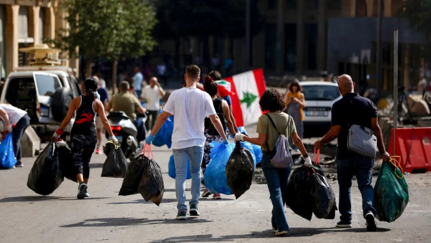 Lebanese activists clean a main road in downtown Beirut. AFP photo