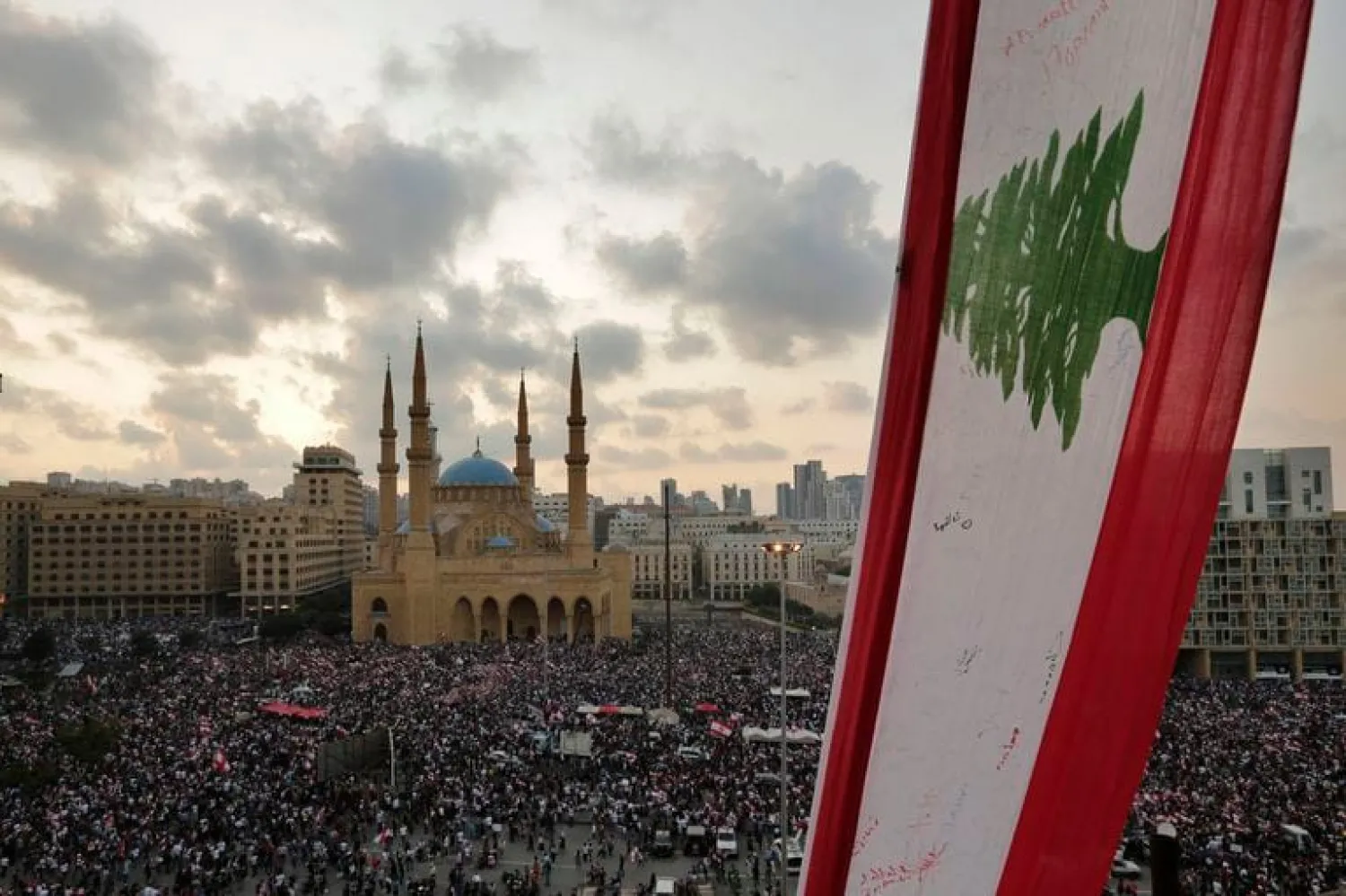 Anti-government protesters shout slogans in Beirut, Lebanon, Sunday, Oct. 20, 2019. Tens of thousands of Lebanese protesters of all ages gathered Sunday in major cities and towns nationwide, with each hour bringing hundreds more people to the streets for the largest anti-government protests yet in four days of demonstrations. (AP Photo/Hassan Ammar)