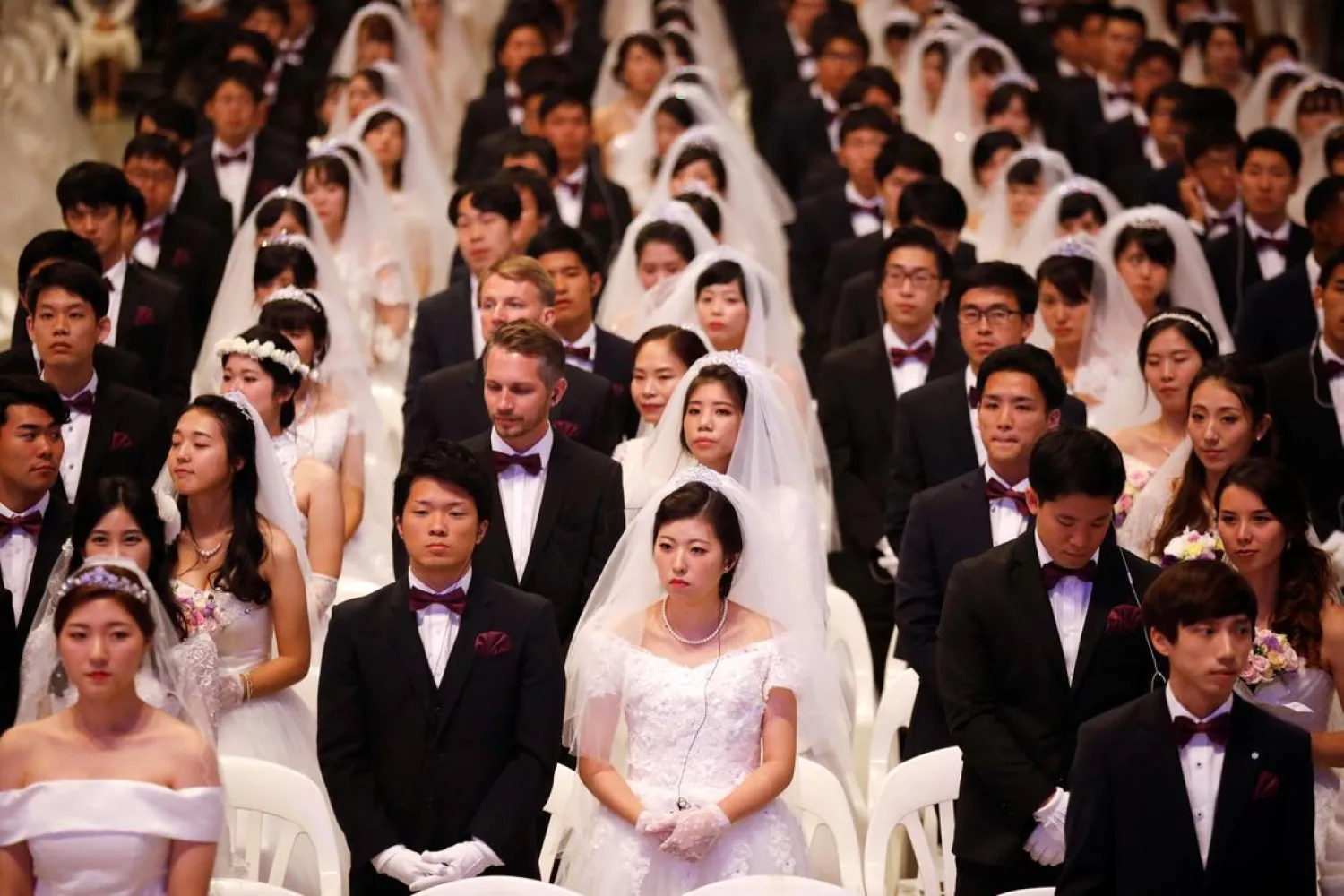 Newlywed couples attend a mass wedding ceremony of the Unification Church at Cheongshim Peace World Centre in Gapyeong, South Korea. Kim Hong-ji / Reuters