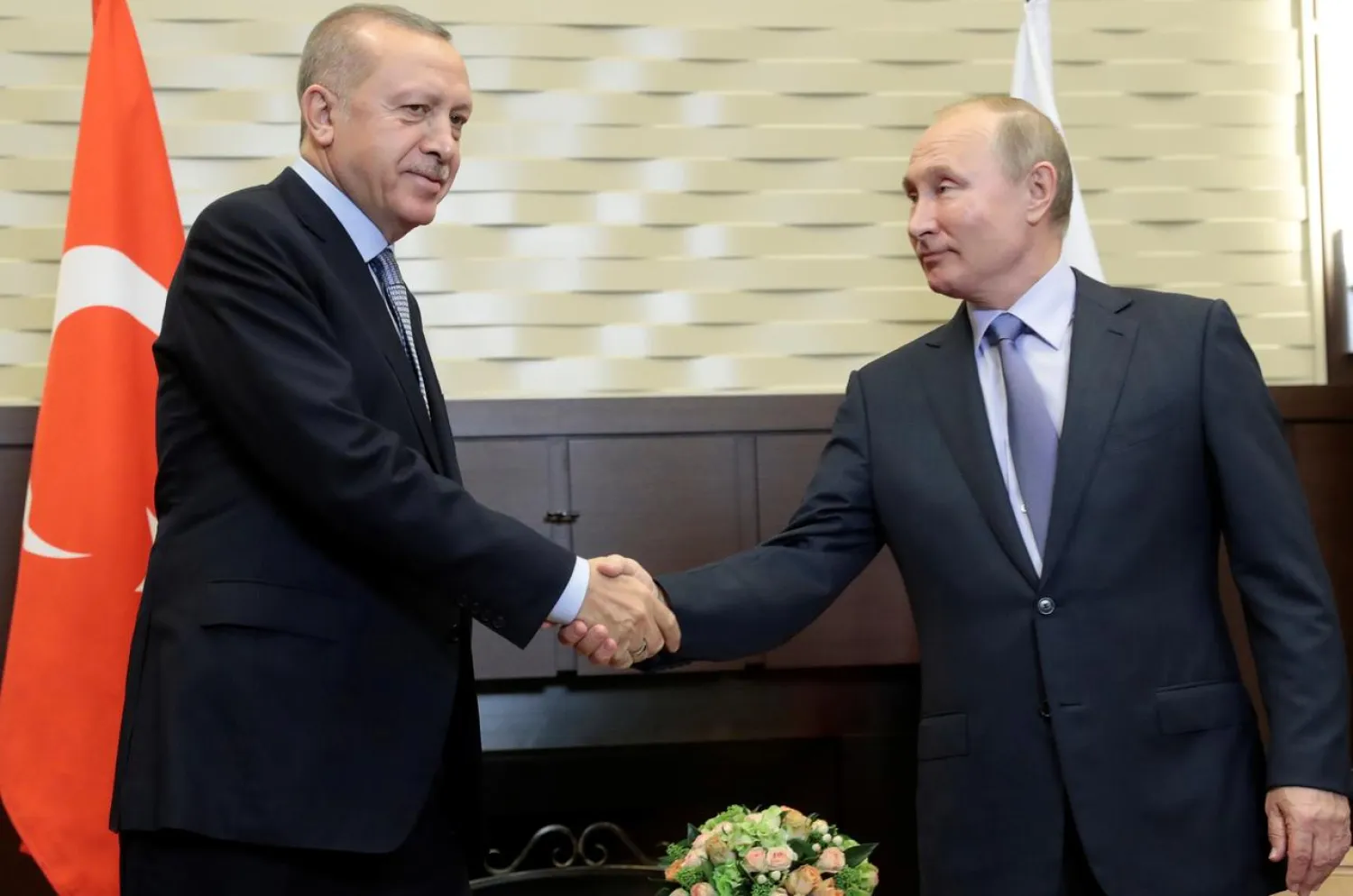 Russian President Vladimir Putin shakes hands with Turkish President Recep Tayyip Erdogan during their meeting in the Black sea resort of Sochi, Russia October 22, 2019. (Reuters)