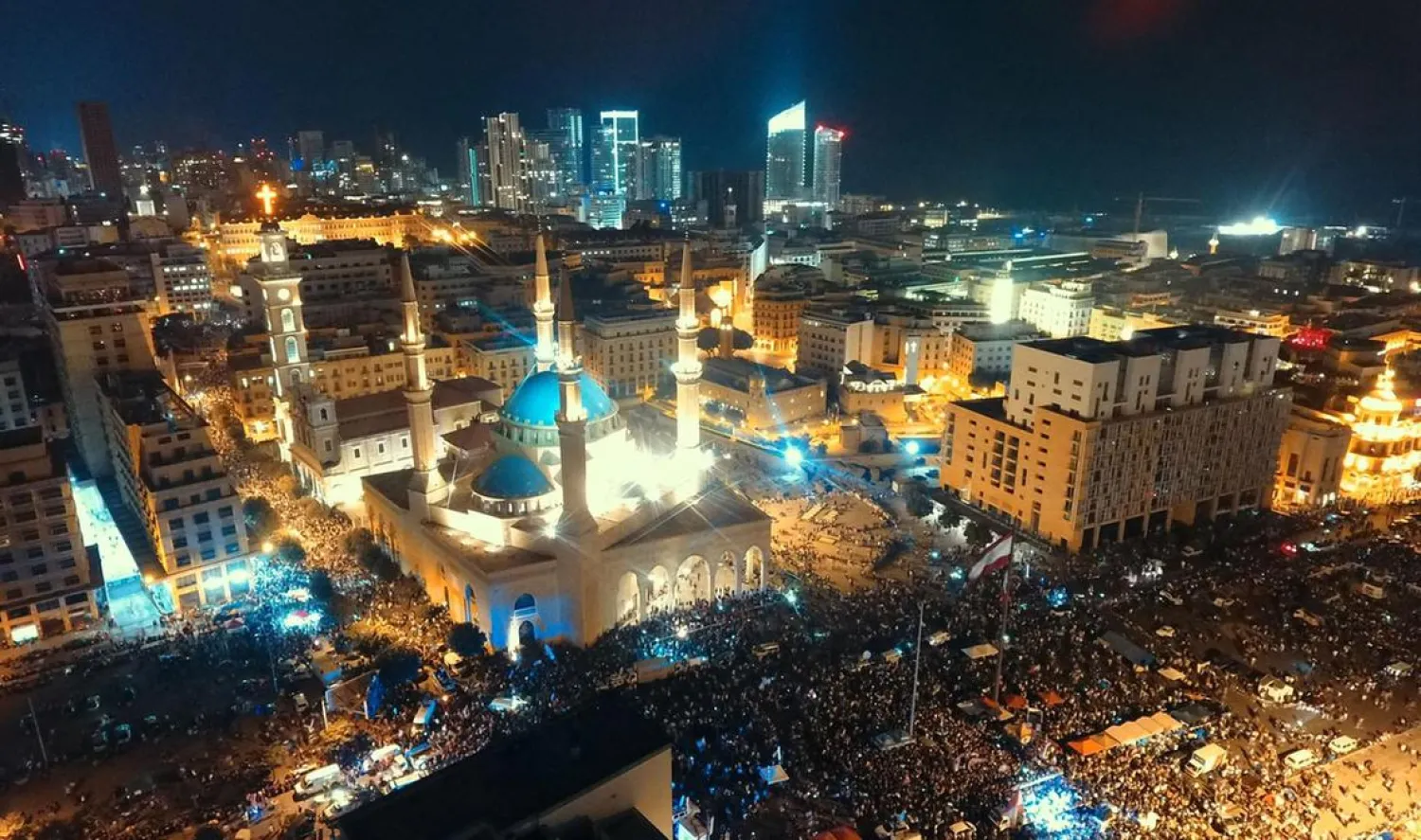 An areal view taken shows Lebanese protesters rallying in downtown Beirut, on the fifth day of demonstrations against tax increases and official corruption. (AFP)
