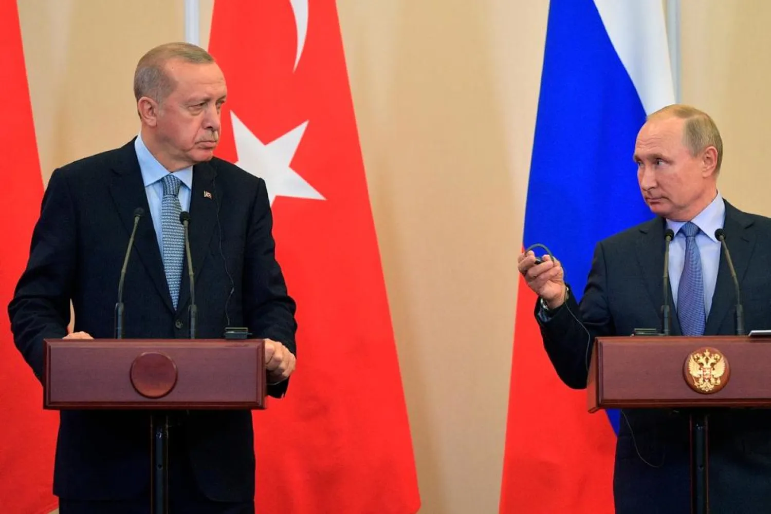 Russian President Vladimir Putin, right, and Turkish President Recep Tayyip Erdogan look at each other during a joint news conference after their talks in the Bocharov Ruchei residence in the Black Sea resort of Sochi, Russia, Tuesday, Oct. 22, 2019. AP