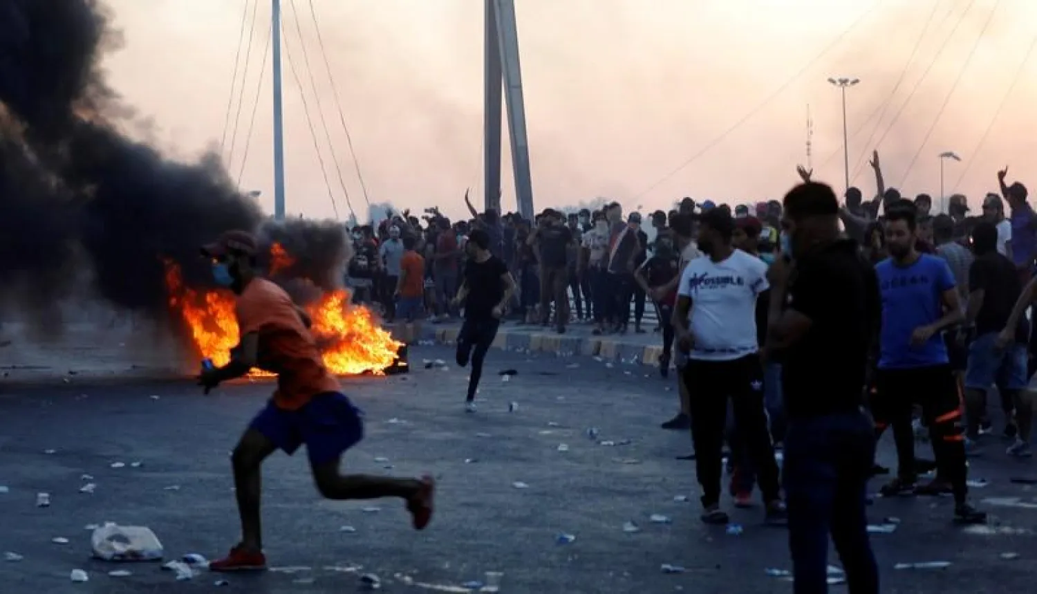 FILE PHOTO: Demonstrators gather during a protest after the lifting of the curfew, following four days of nationwide anti-government protests that turned violent, in Baghdad, Iraq October 5, 2019. REUTERS/Thaier Al-Sudani/File Photo