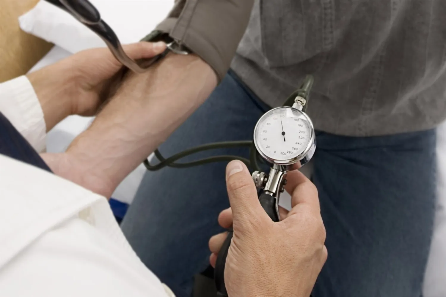A doctor checks a patient's blood pressure. Getty Images