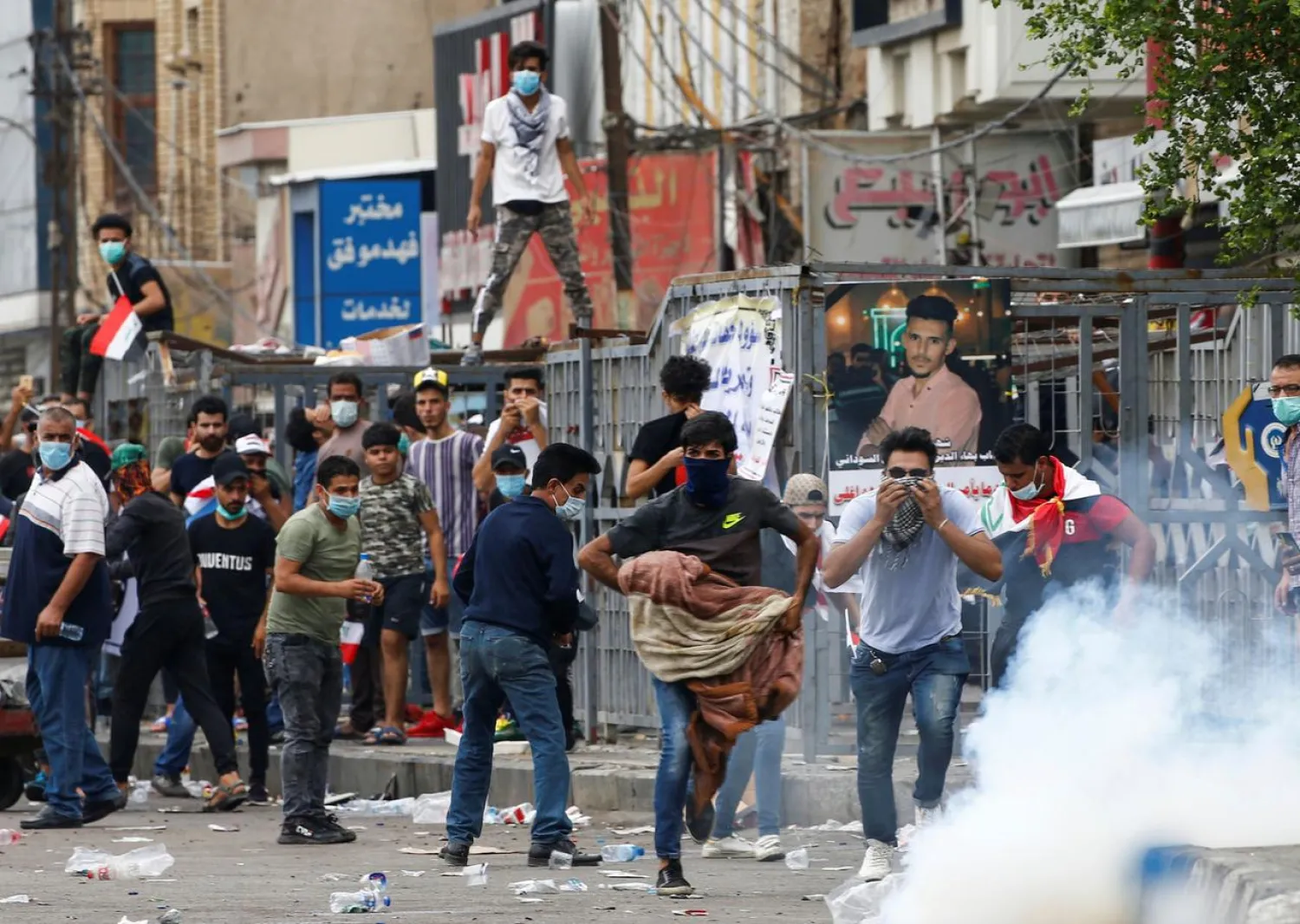 Demonstrators disperse as Iraqi Security forces use tear gas during a protest over corruption, lack of jobs, and poor services, in Baghdad, Iraq October 25, 2019. (Reuters)
