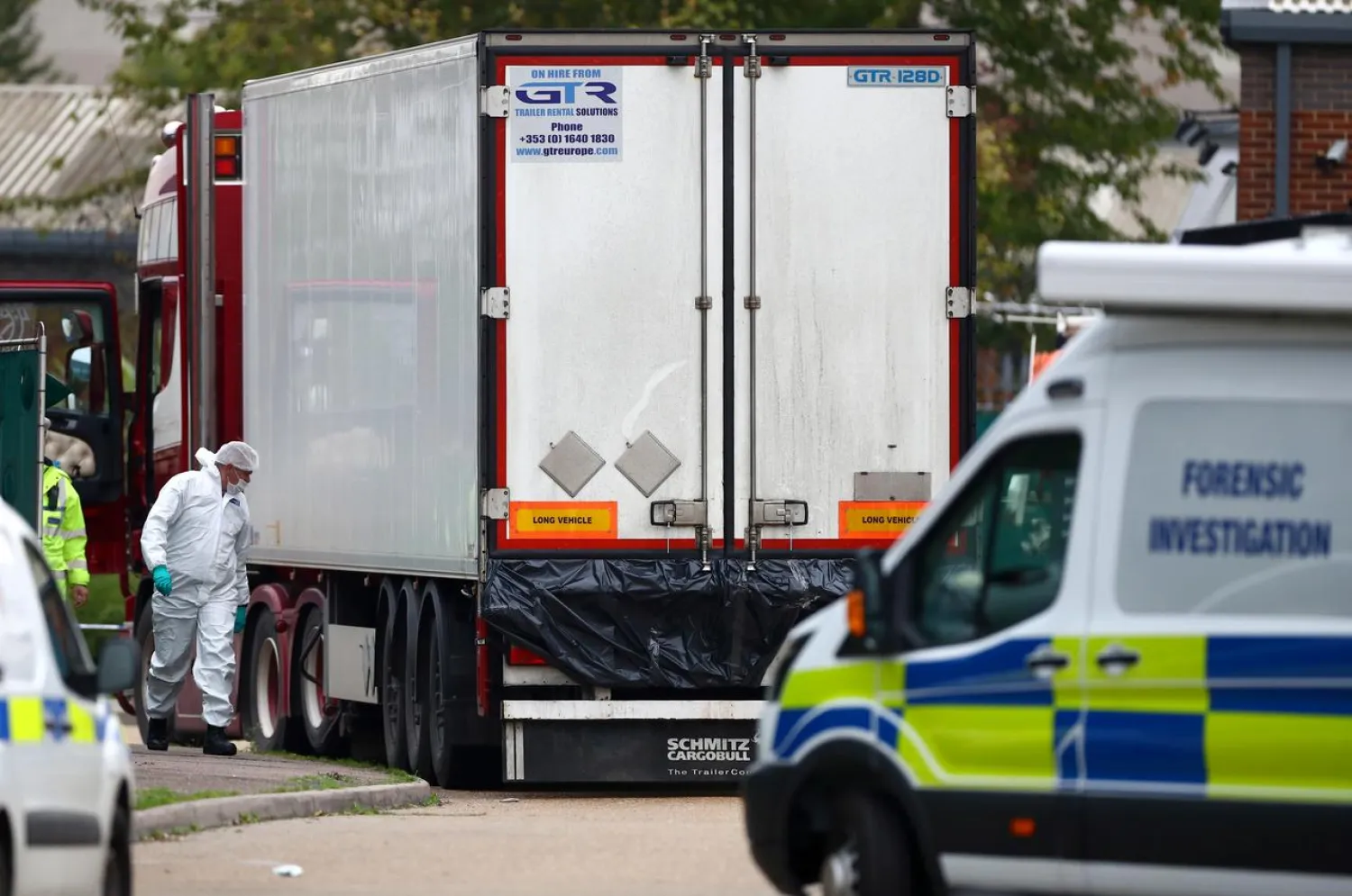 Police are seen at the scene where bodies were discovered in a lorry container, in Grays, Essex, Britain October 23, 2019. REUTERS/Hannah McKay