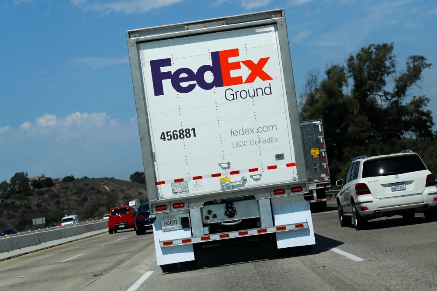 A Federal Express truck travels down a highway through Carlsbad, California on September 16, 2019. (Reuters)