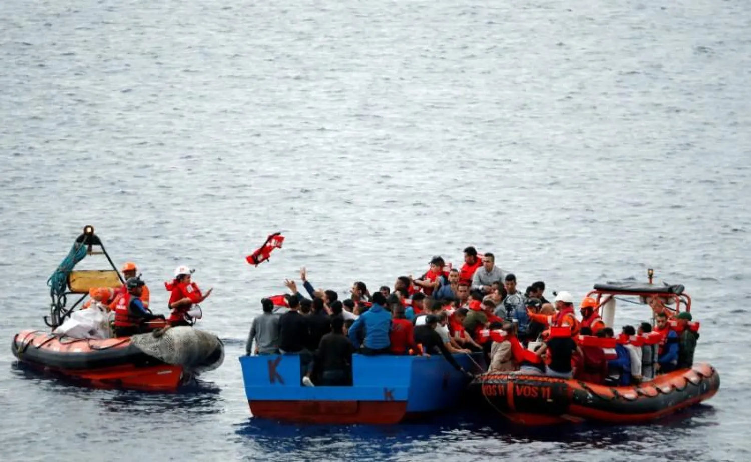 Migrants on a wooden boat are rescued by "Save the Children" NGO crew from the ship Vos Hestia in the Mediterranean sea off Libya coast, June 18, 2017. REUTERS/Stefano Rellandini
