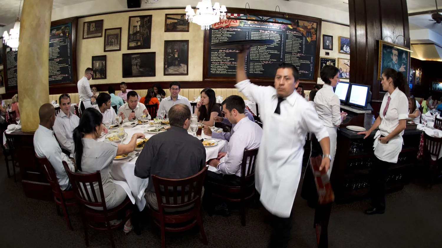 A waiter at Tony's Restaurant, part of the Casablanca Hotel, in
Times Square in New York. | DON EMMERT/AFP/Getty Images