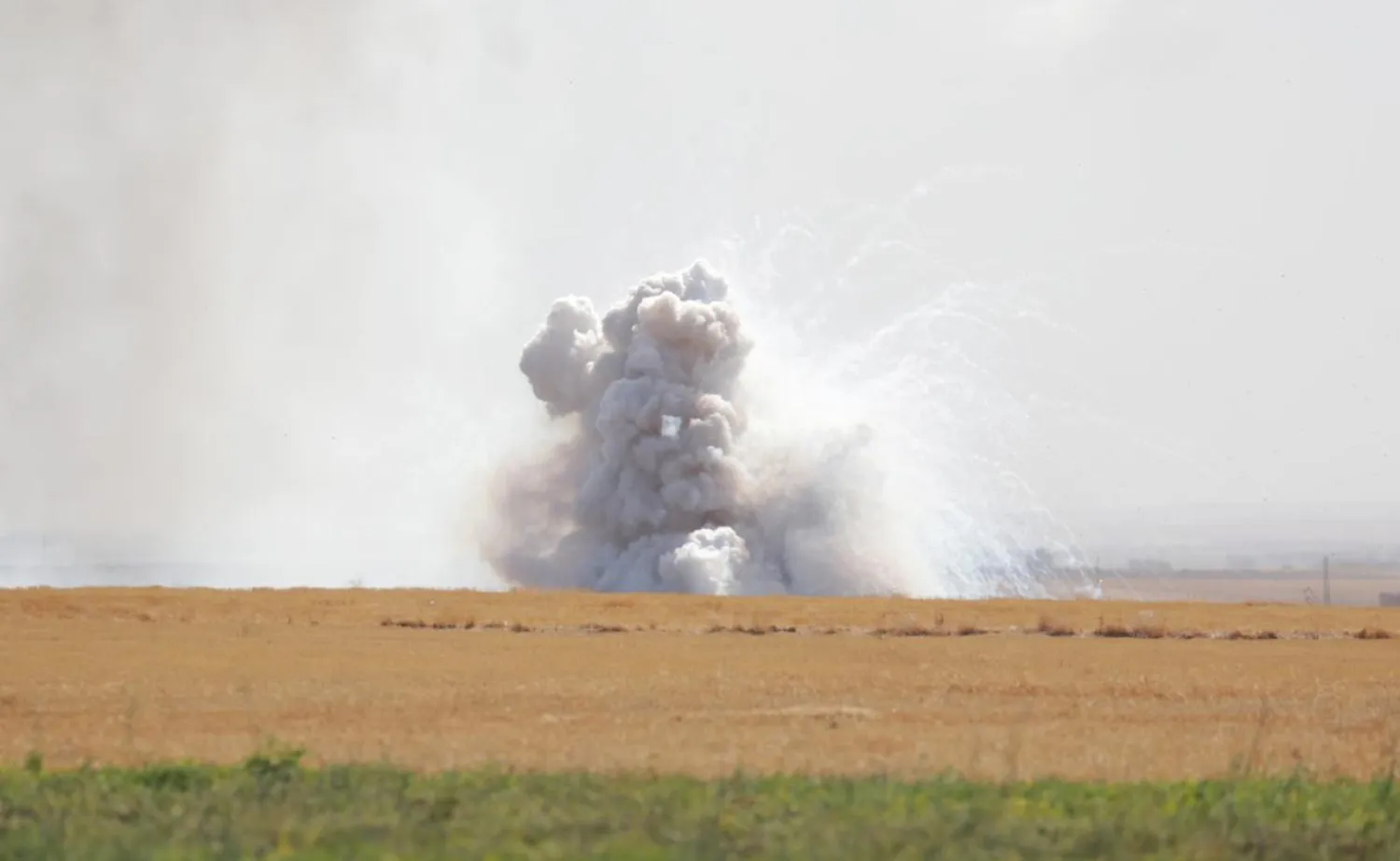 Smoke rises near the border town of Tel Abyad, Syria, October 12, 2019. (Reuters)