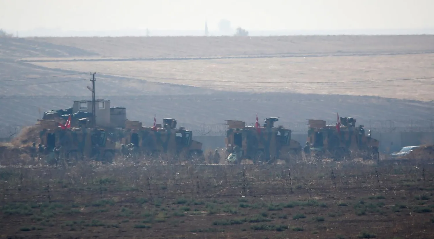 Turkish military vehicles arrive at the Turkish-Syrian border before a joint Turkish-Russian patrol in northeast Syria, near the Turkish border town of Kiziltepe, Turkey, November 1, 2019. (Reuters)