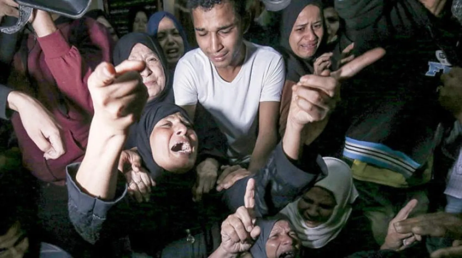 Relatives of Palestinian youth Ahmed al-Shehri, who was killed in the Israeli raids on Saturday, November 2, 2019 (AFP)