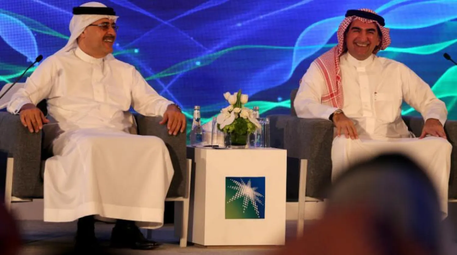 Saudi Aramco Yönetim Kurulu Başkanı Yasir  er-Rumeyyan ve şirket CEO'su Mühendis Emin el-Nasır (Reuters)