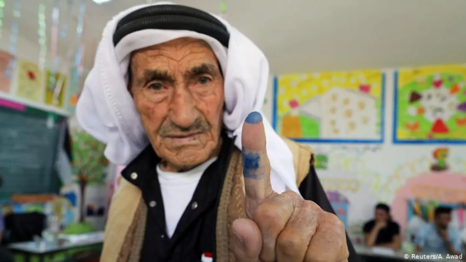 Man showing his finger after voting (Reuters)
