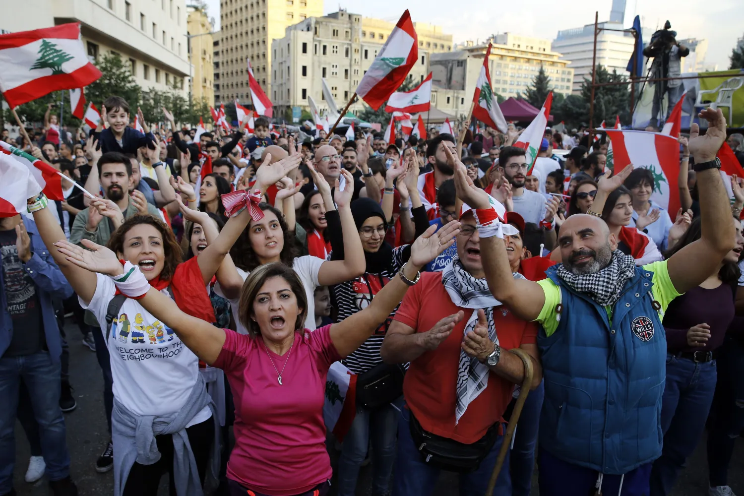 Anti-government protesters chant slogans against the Lebanese government, in Beirut, Lebanon, Sunday, Nov. 3, 2019. AP