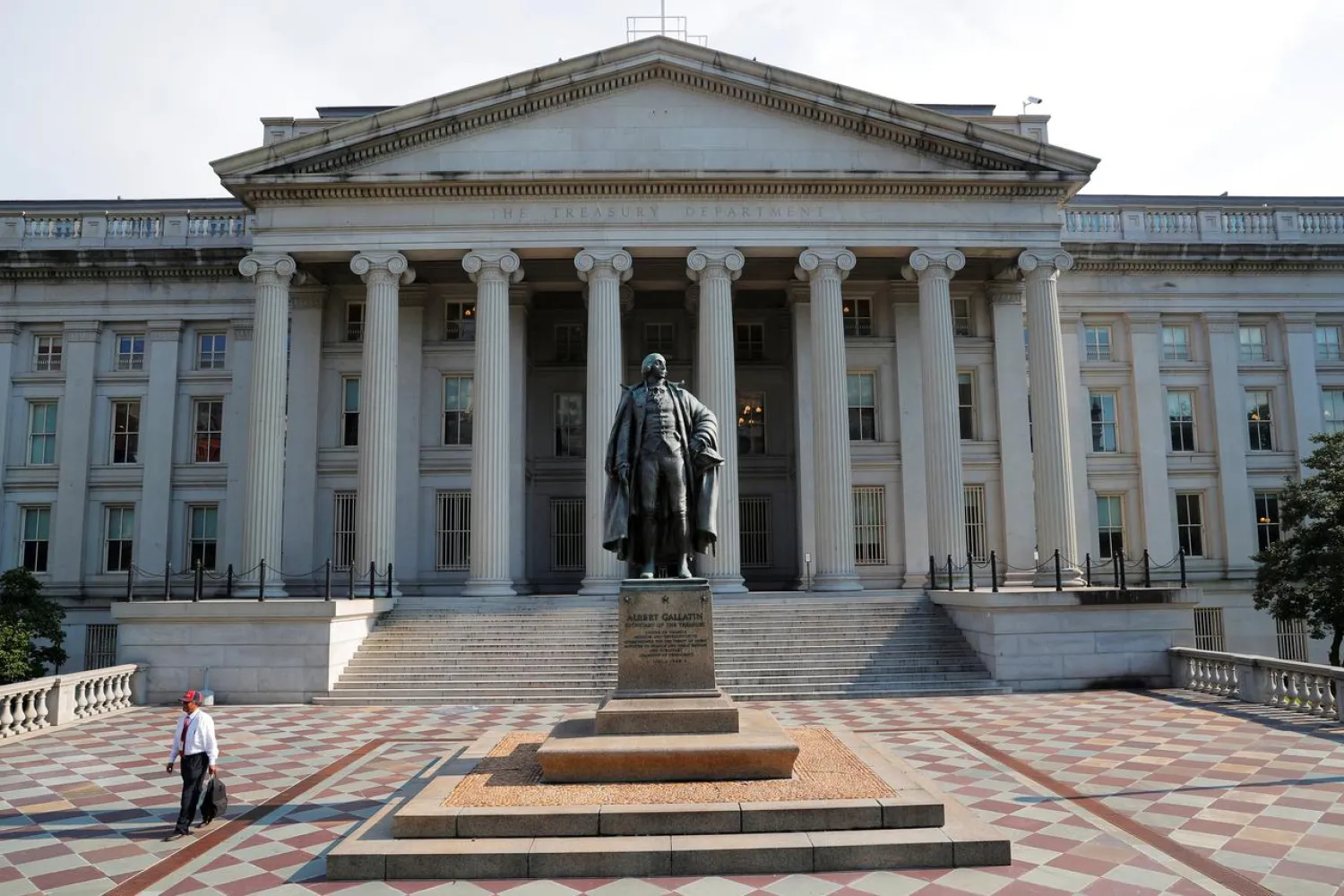 A man walks away from the US Treasury Department in Washington, US, August 6, 2018. (Reuters)