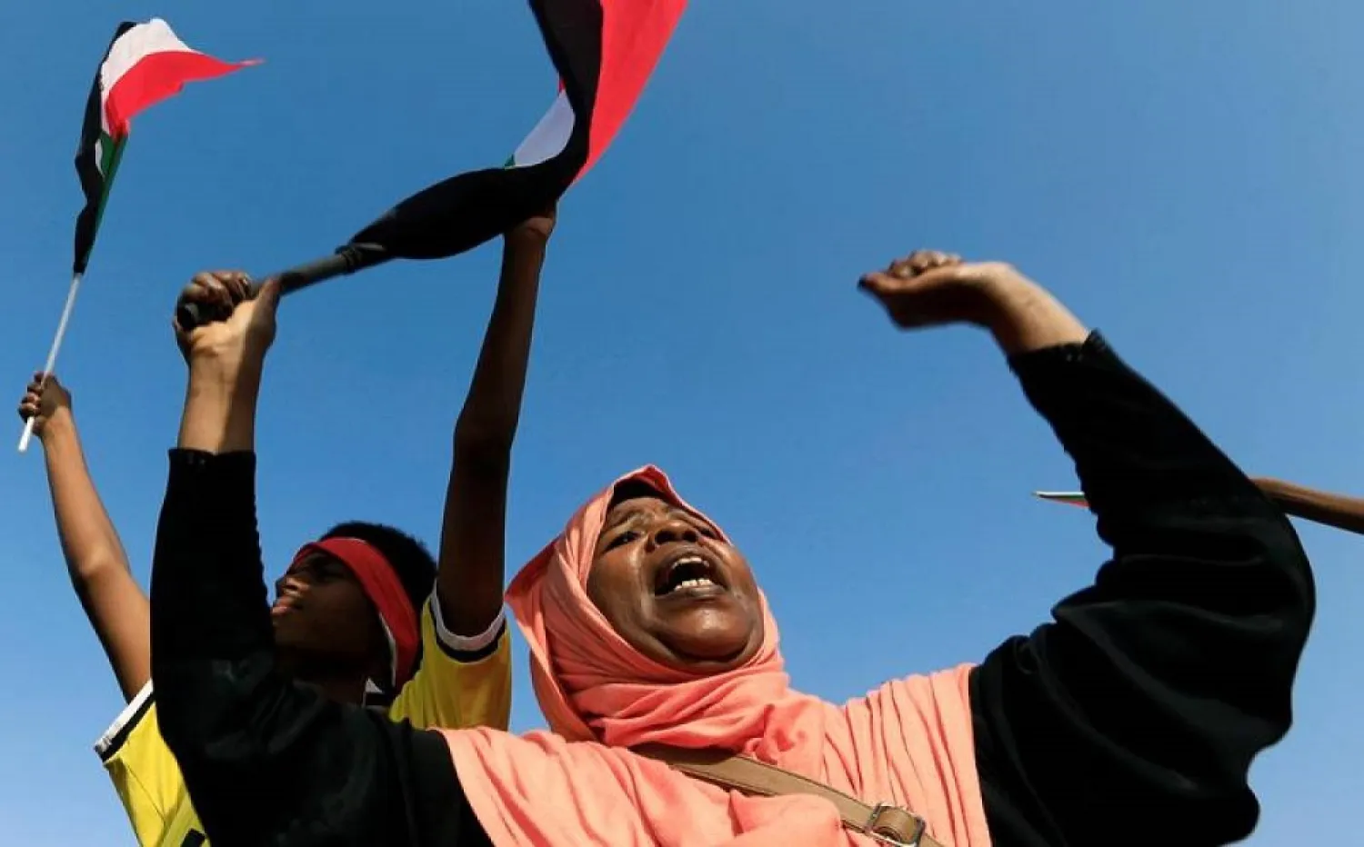 A Sudanese woman celebrates after Sudan's ruling military council and opposition and protest groups reached a power-sharing deal in Khartoum, Sudan July 5, 2019. (Reuters)