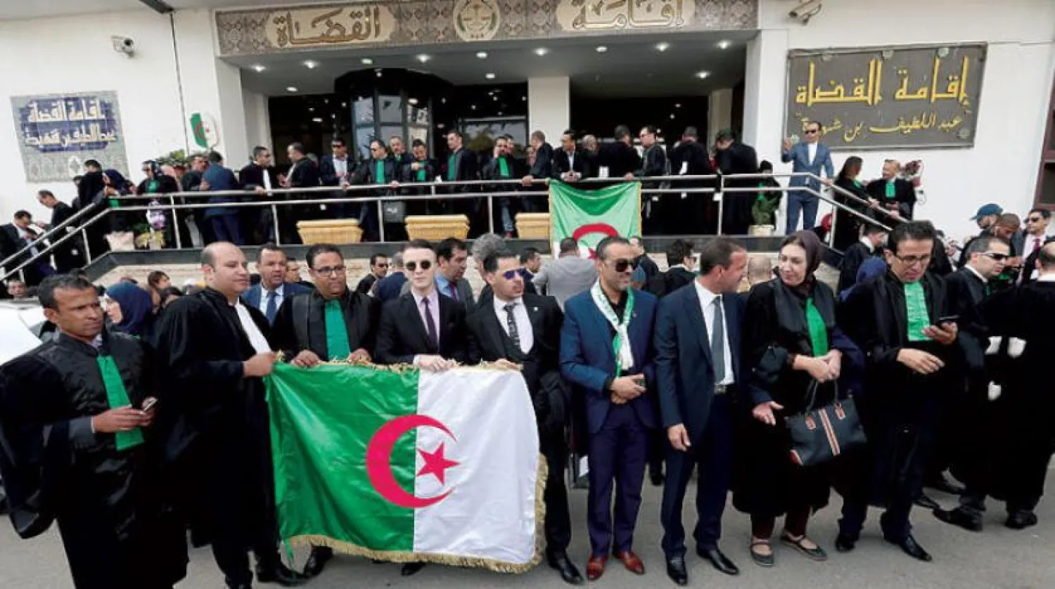Algerian judges and prosecutors hold national flags as they take part in a protest to demand the independence of the judiciary in Algiers, Algeria, 31 October 2019. EPA/MOHAMED MESSARA