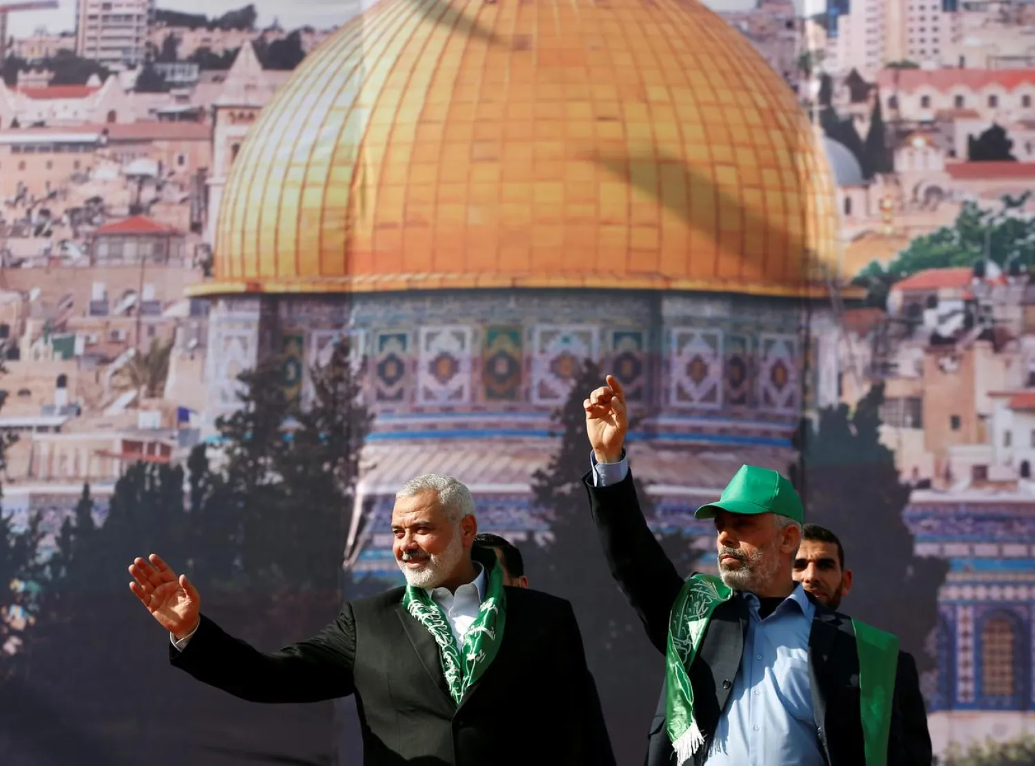 Hamas chief Ismail Haniyeh and Gaza's Hamas chief Yehya al-Sinwar gesture to supporters during a rally marking the 30th anniversary of Hamas' founding, in Gaza City December 14, 2017. (Reuters)