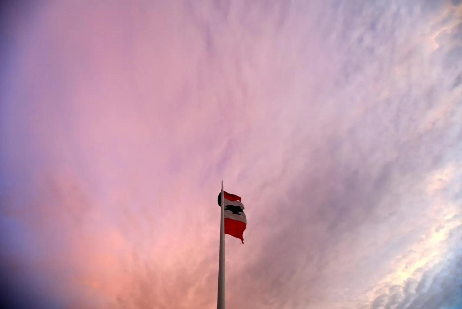 A Lebanese flag flutters on a pole at sunset in Beirut, Lebanon, November 5, 2018. (Reuters)