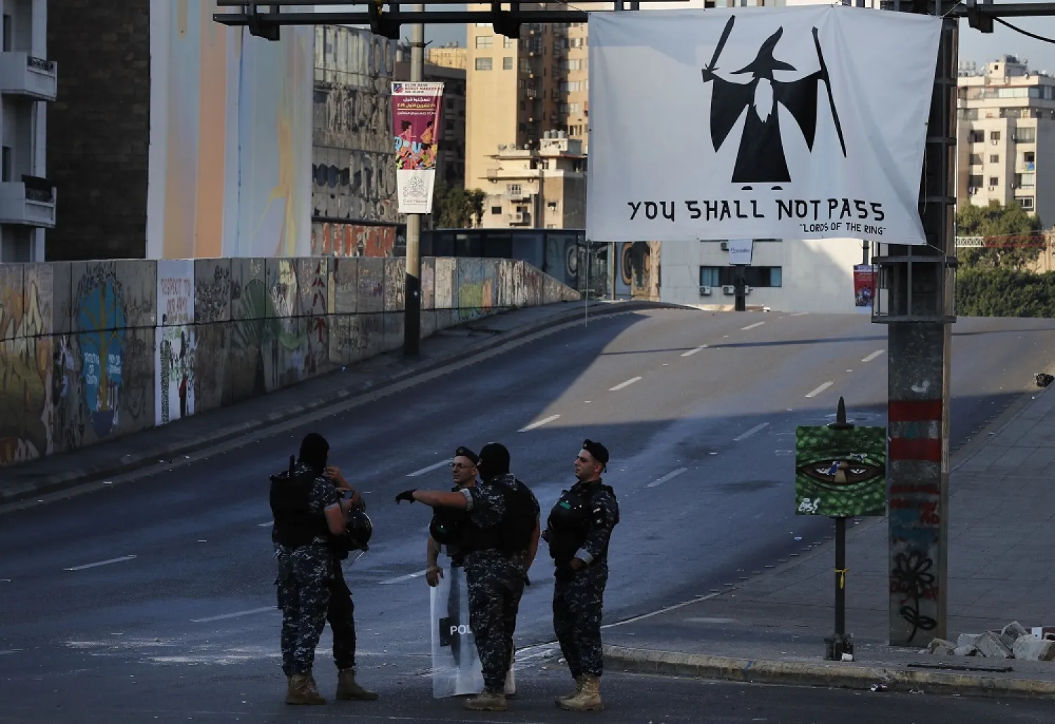 Riot police stand guard on a main highway blocked by anti-government protesters during ongoing protests against the Lebanese government in Beirut, Lebanon, November 4, 2019. (AP)