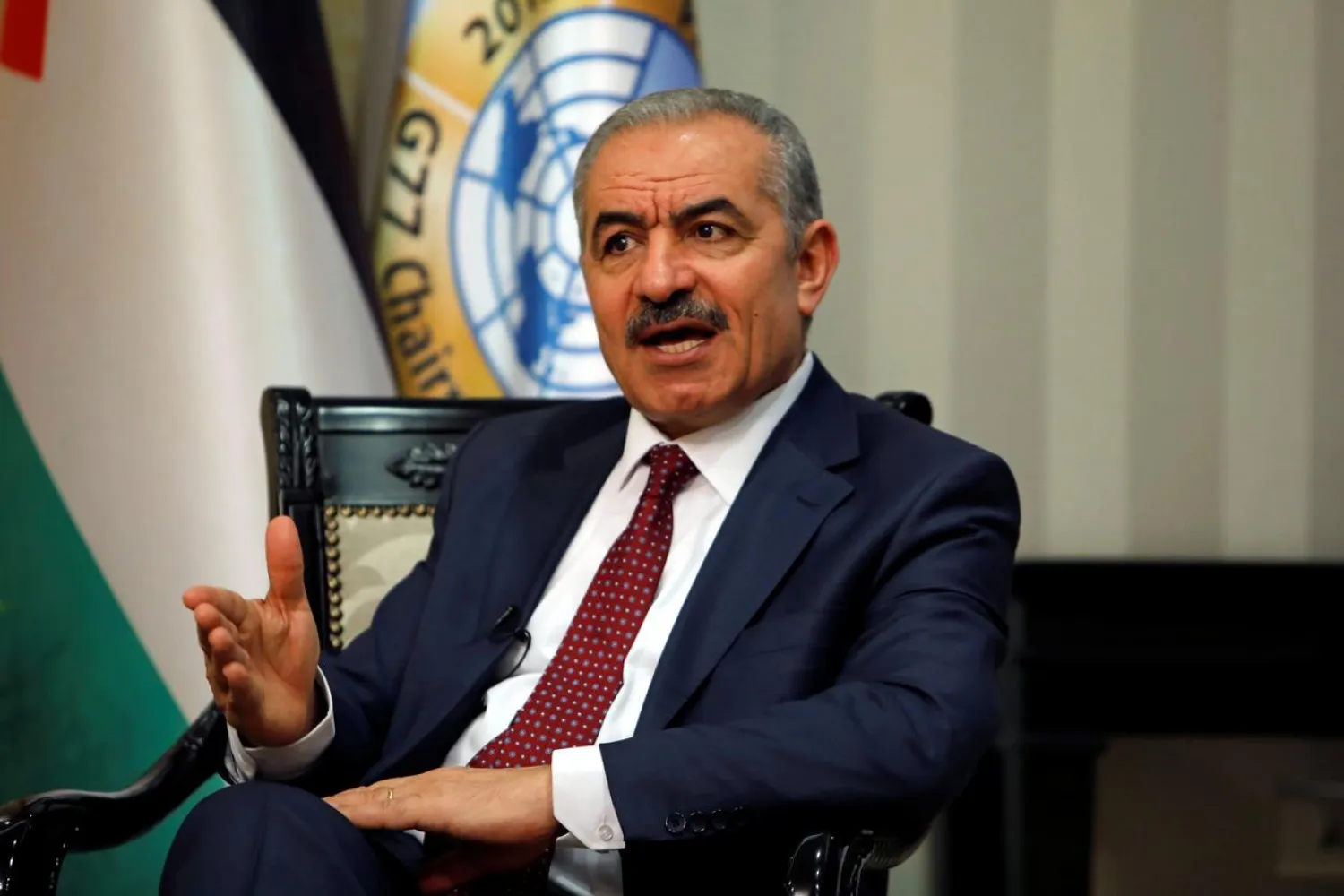 Palestinian Prime Minister Mohammad Shtayyeh gestures during an interview with Reuters in his office in Ramallah, in the Israeli-occupied West Bank, June 27, 2019. REUTERS/Raneen Sawafta
