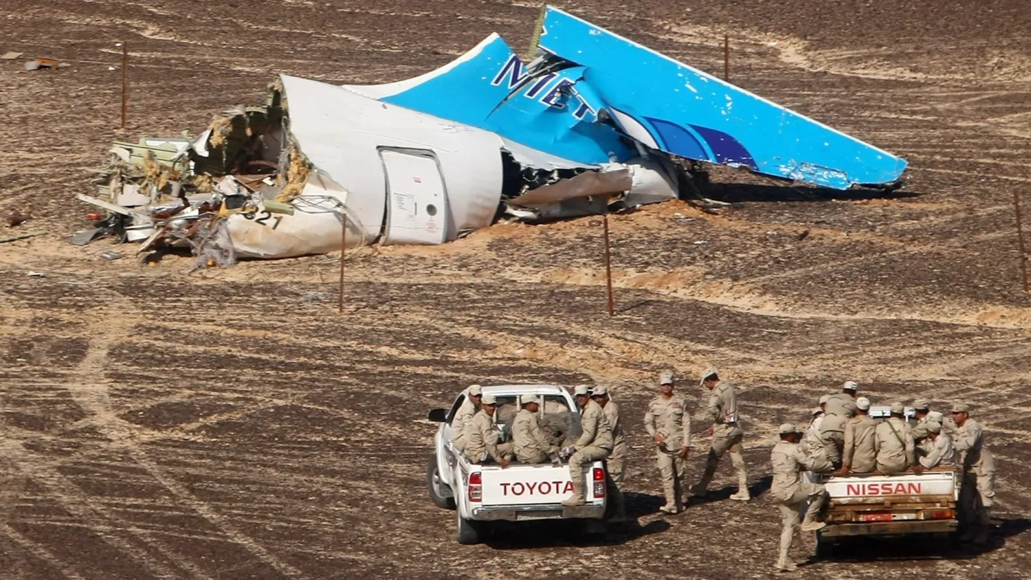 Egyptian troops approach wreckage from the Metrojet airliner that crashed in the Sinai in 2015 (Reuters)

