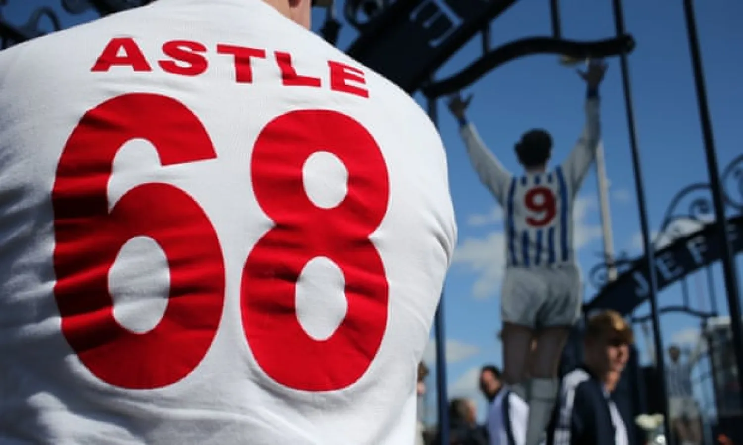  A fan at the Jeff Astle gates at the Hawthorns in a shirt honouring the FA Cup won in 1968 by the striker and his West Brom teammates. Photograph: Matthew Ashton/Corbis via Getty Images
