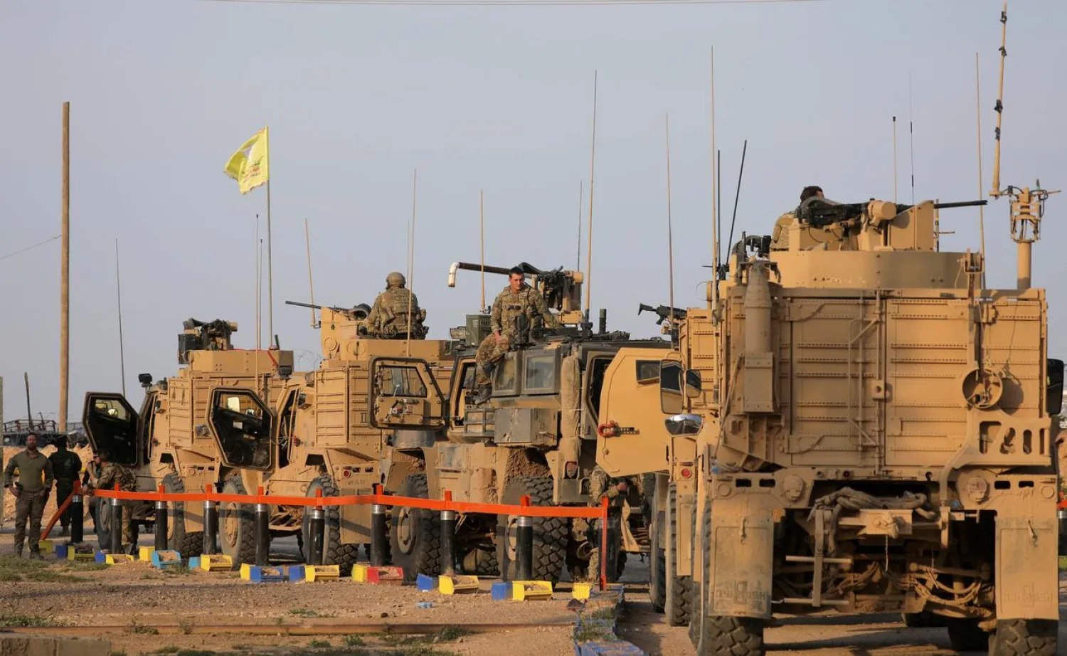 American soldiers stand near military trucks, at al-Omar oil field in Deir Ezzour, Syria March 23, 2019. (Reuters)