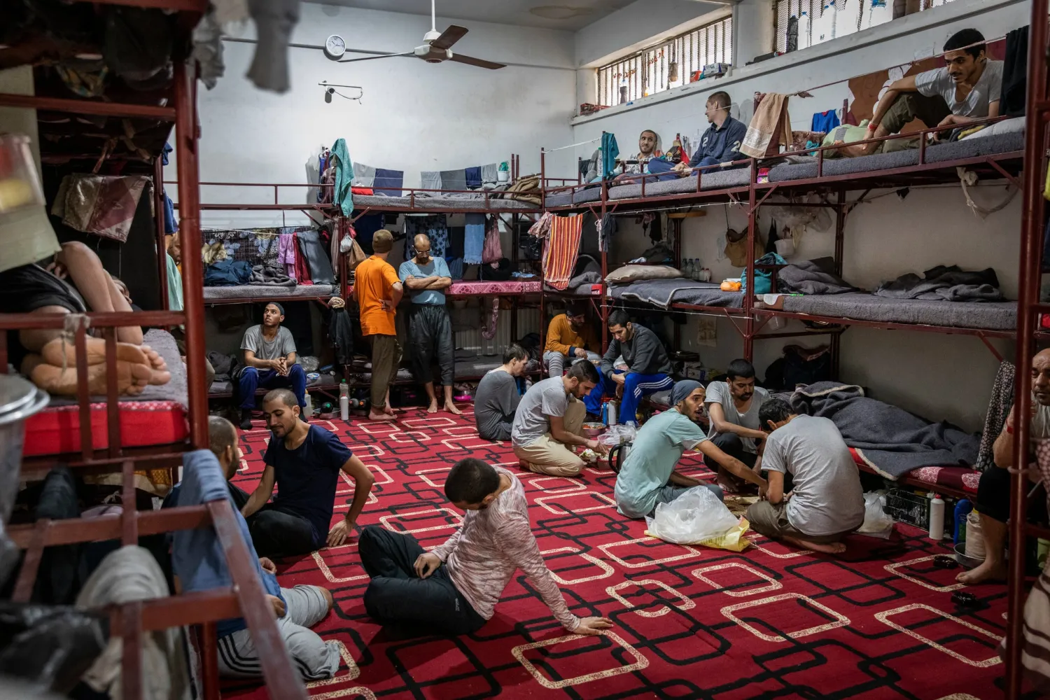 Suspected ISIS members in their cell at a Kurdish-controlled prison in northeast Syria last month.Credit...Ivor Prickett for The New York Times