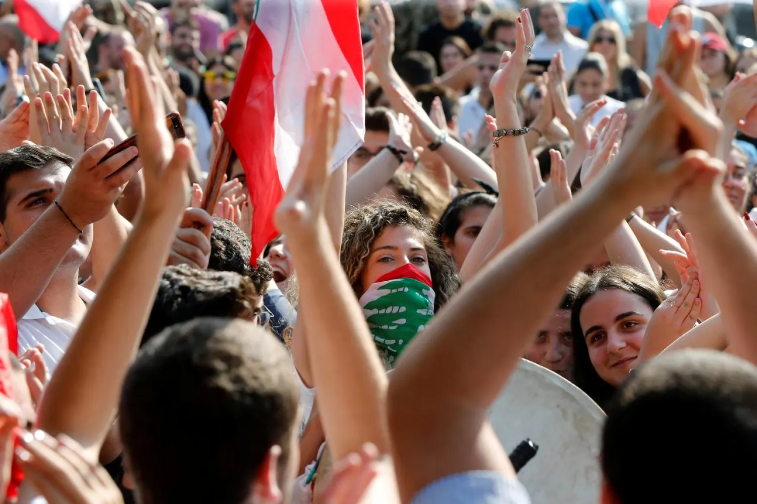 Students gesture as they protest near the Zouk Mosbeh power station in Zouk, north of Beirut on November 7, 2019. (Reuters)