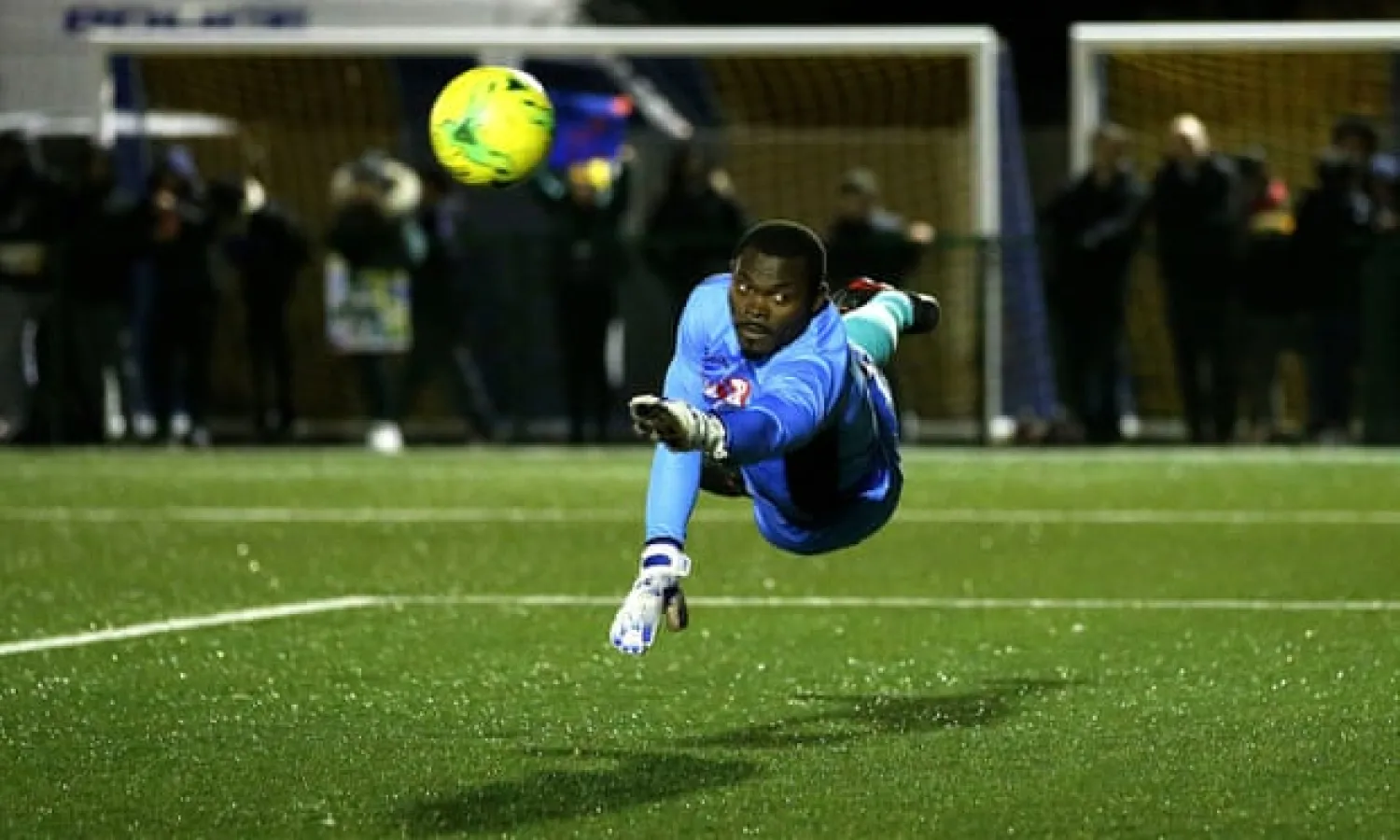  Haringey Borough goalkeeper Valery Pajetat dives for the ball during the FA Cup qualifying replay against Yeovil, who won 3-0. Photograph: Steven Paston/PA
