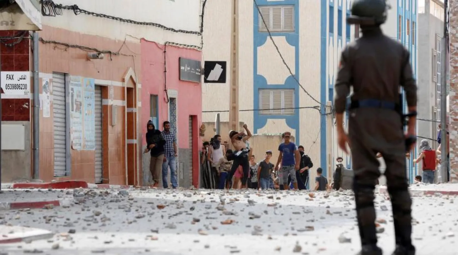 File photo: Protesters throw stones towards riot police in Morocco. Reuters/Youssef Boudlal