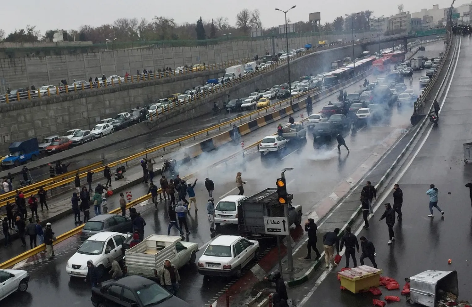 People protest against gasoline price hikes, on a highway in Tehran, Iran on November 16, 2019. (Reuters)