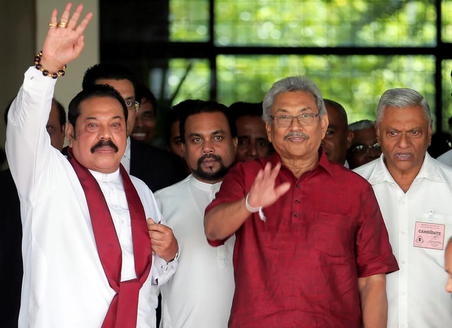 FILE PHOTO: Gotabaya Rajapaksa, Sri Lanka People's Front party presidential election candidate and former wartime defense chief, with his brothers, Mahinda Rajapaksa, former president and opposition leader and Chamal Rajapaksa (R) are seen as they leave after handing over nomination papers at the election commission ahead of Sri Lanka's presidential election in Colombo, Sri Lanka October 7, 2019. REUTERS/Dinuka Liyanawatte