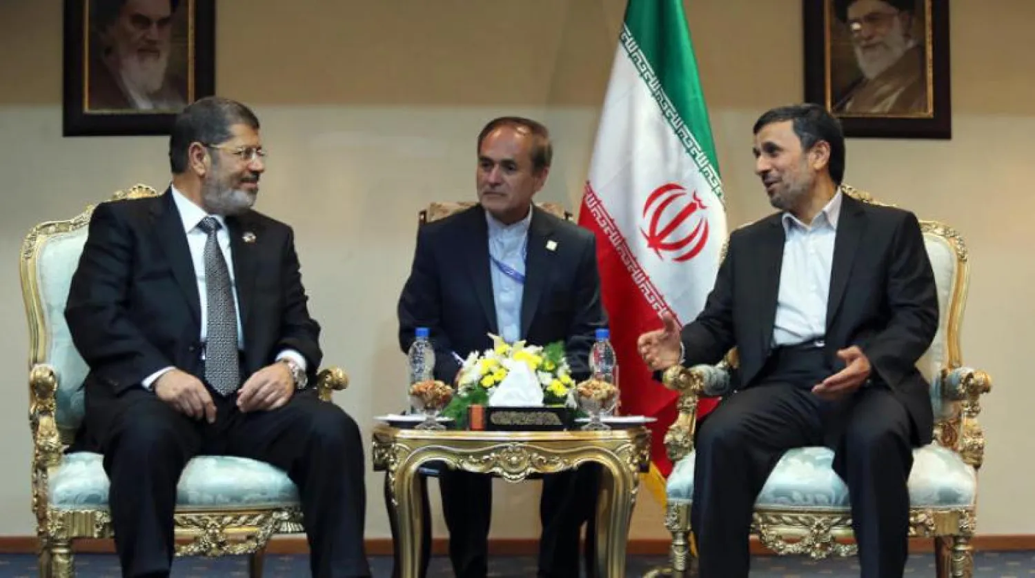 Former Egyptian president Mohammed Morsi and his Iranian counterpart Mahmoud Ahmadinejad meet in Tehran in 2012. AFP file photo