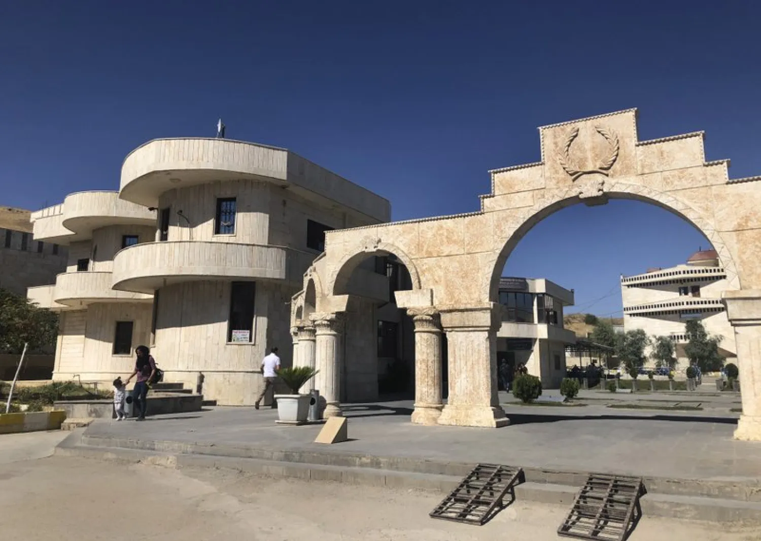 Syrians walk at the border crossing between Iraq and Syria in Semelka, northeast Syria, Monday Oct. 14, 2019. (AP)