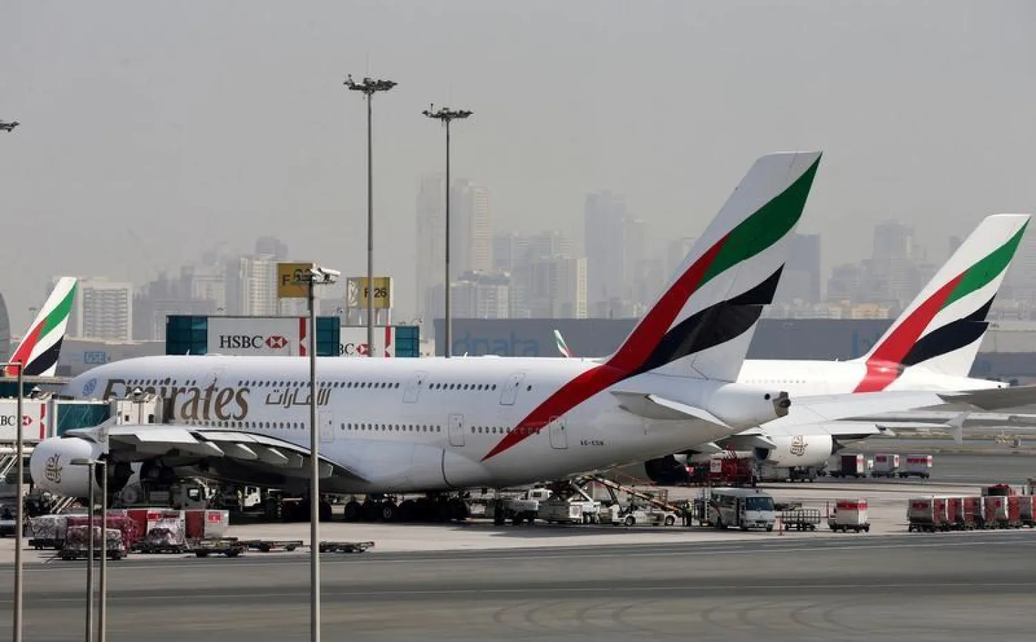FILE PHOTO: Emirates aircraft are seen at Dubai International Airport, United Arab Emirates May 10, 2016. REUTERS/Ashraf Mohammad/File Photo
