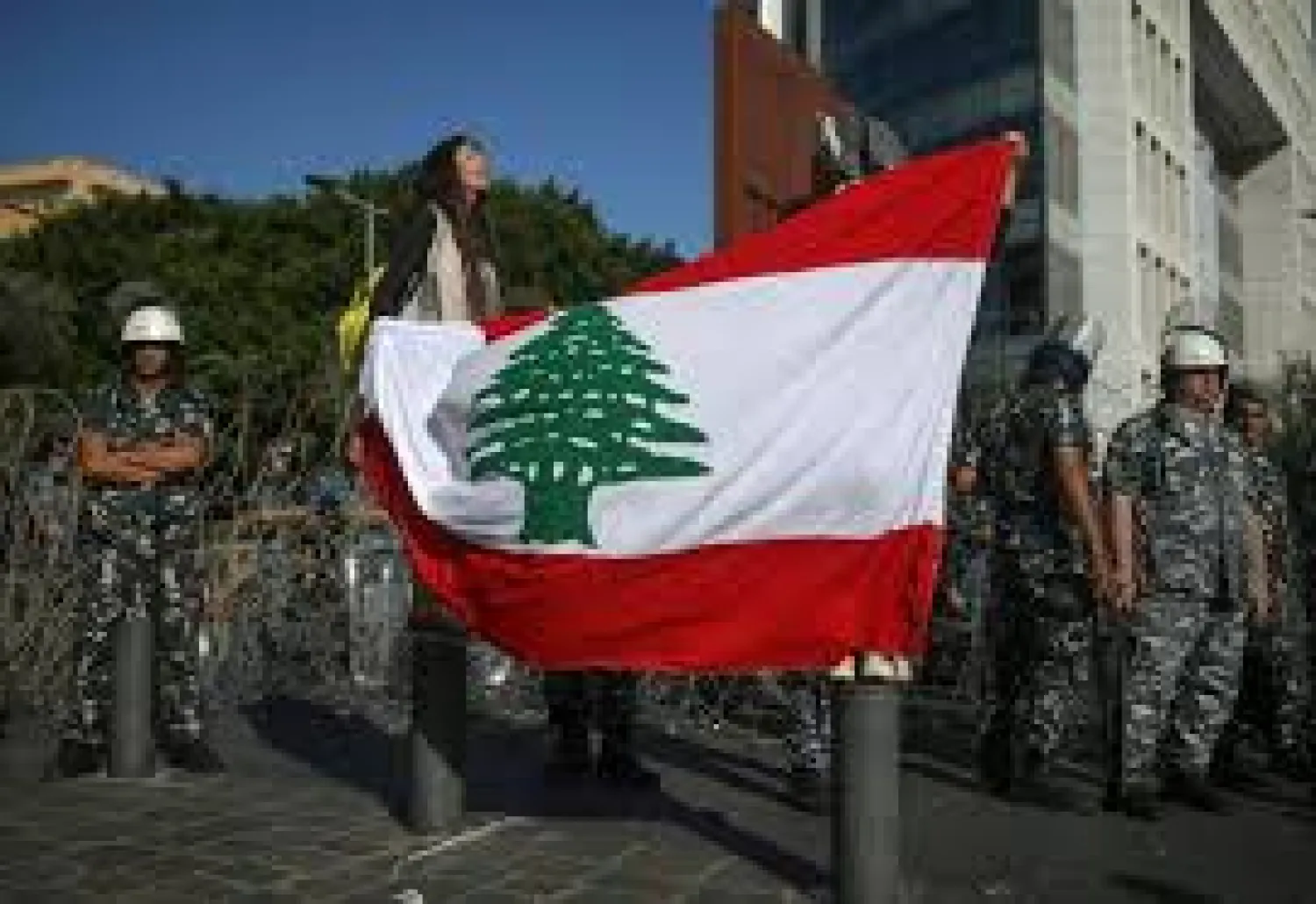 Lebanese anti-government protesters say their country's "real independence" is close as Lebanon marks its 76th national day | AFP
