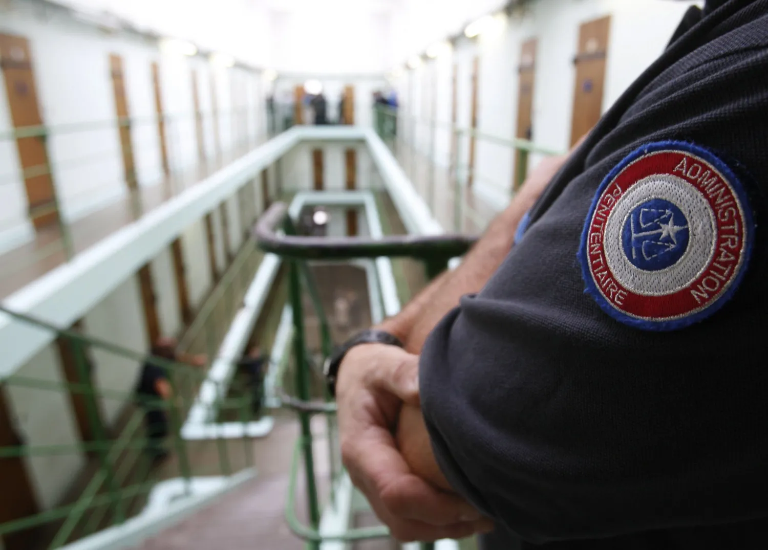 A French prison warder guards the corridors of a jail in southwestern France, September 5, 2008. REGIS DUVIGNAU/REUTERS