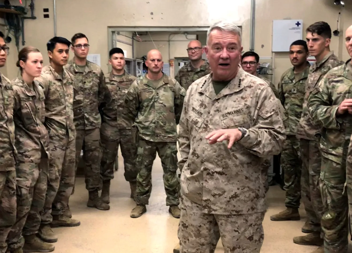 US Central Command chief General Kenneth McKenzie speaks with US troops in Afghanistan. Reuters file photo