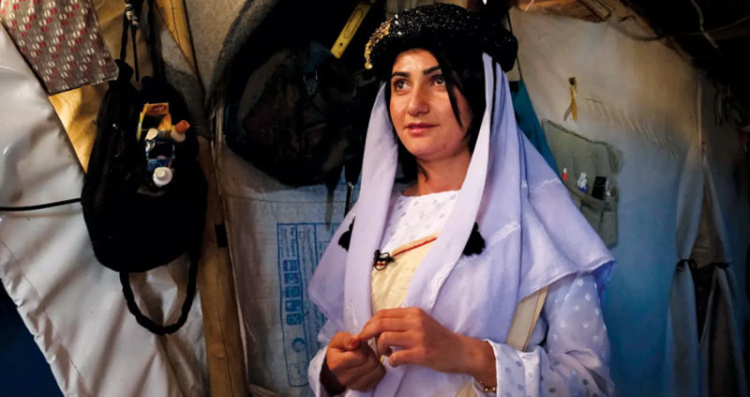 إيمان عباس تمكنت من حفظ 101 صفحة من القرآن الكريم قبل إطلاق سراحها (أ.ف.ب)