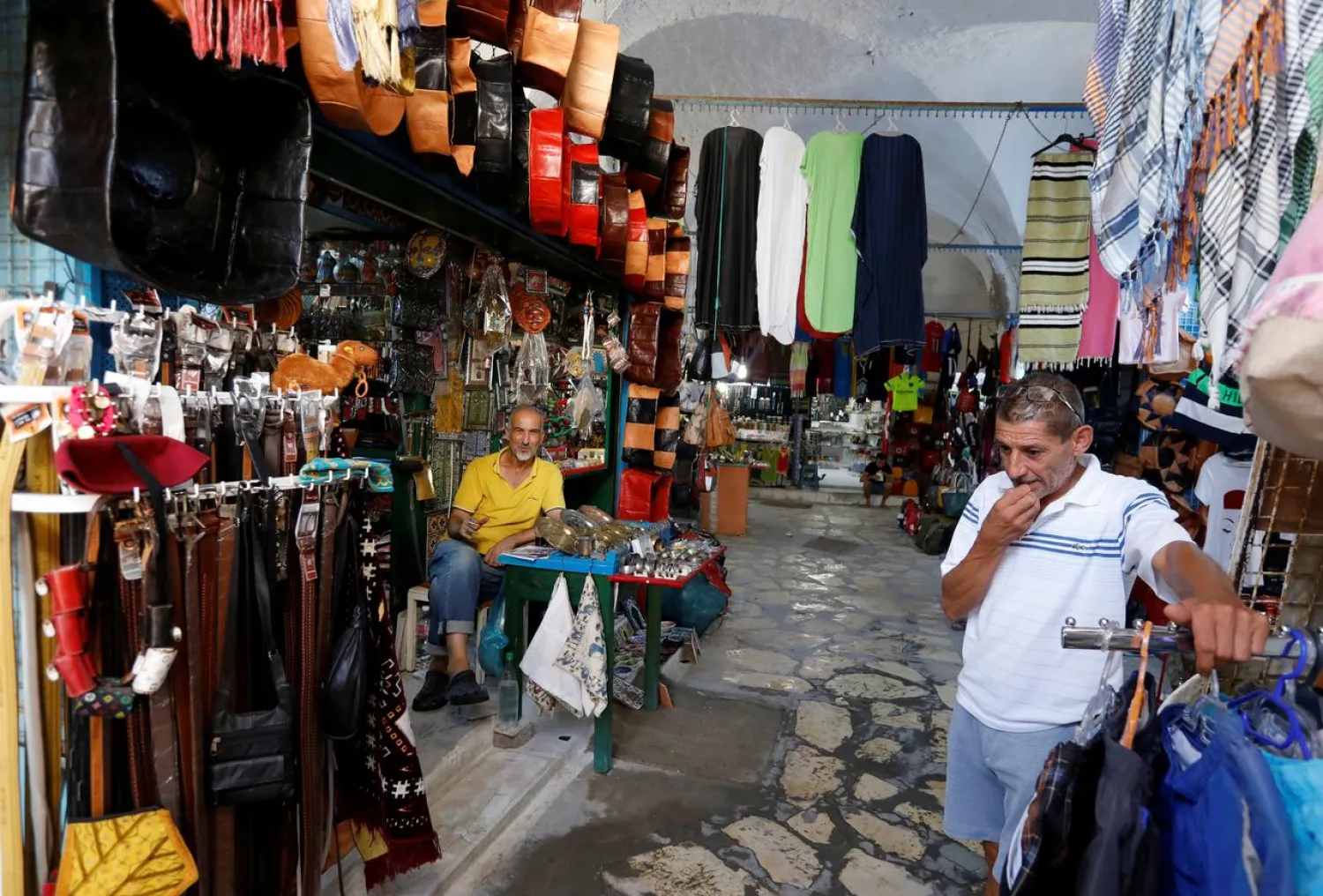 Shopkeepers wait for customers in front of a souvenir shop following Thomas Cook's collapse, in Hammamet, Tunisia, September 24, 2019. REUTERS/Zoubeir Souissi