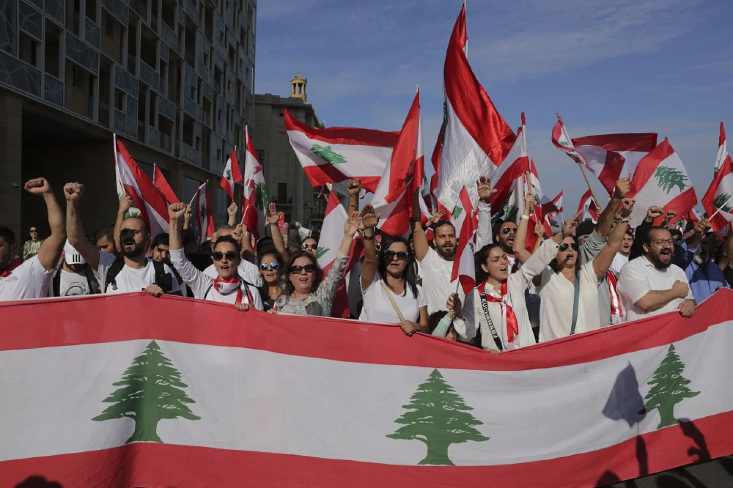 Anti-government protesters shout slogans during a civil parade at Martyrs' square, in downtown Beirut, Lebanon, Friday, Nov. 22, 2019. (AP)