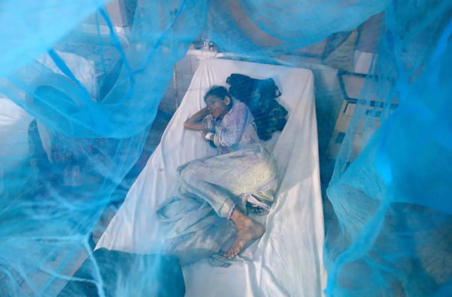 A patient suffering from dengue fever receives medical treatment at an isolation ward of a local hospital in Karachi, Pakistan, 19 September 2019. EPA