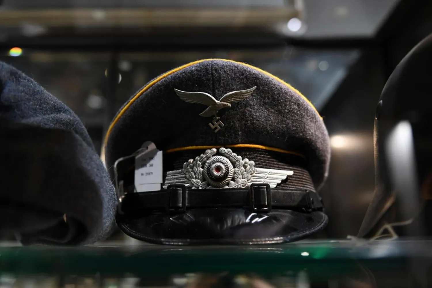 A Nazi-era Luftwaffe insignia is seen on a hat in a cupboard at
the auction house Hermann Historica in Munich. Reuters.