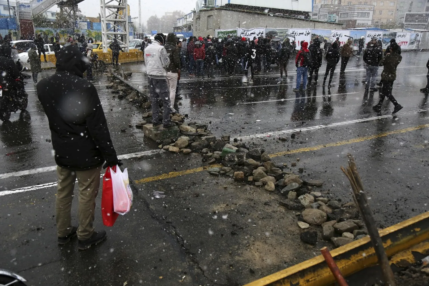 A road is blocked by protestors after authorities raised gasoline prices, in Tehran, Iran, Saturday, Nov. 16, 2019. (AP)