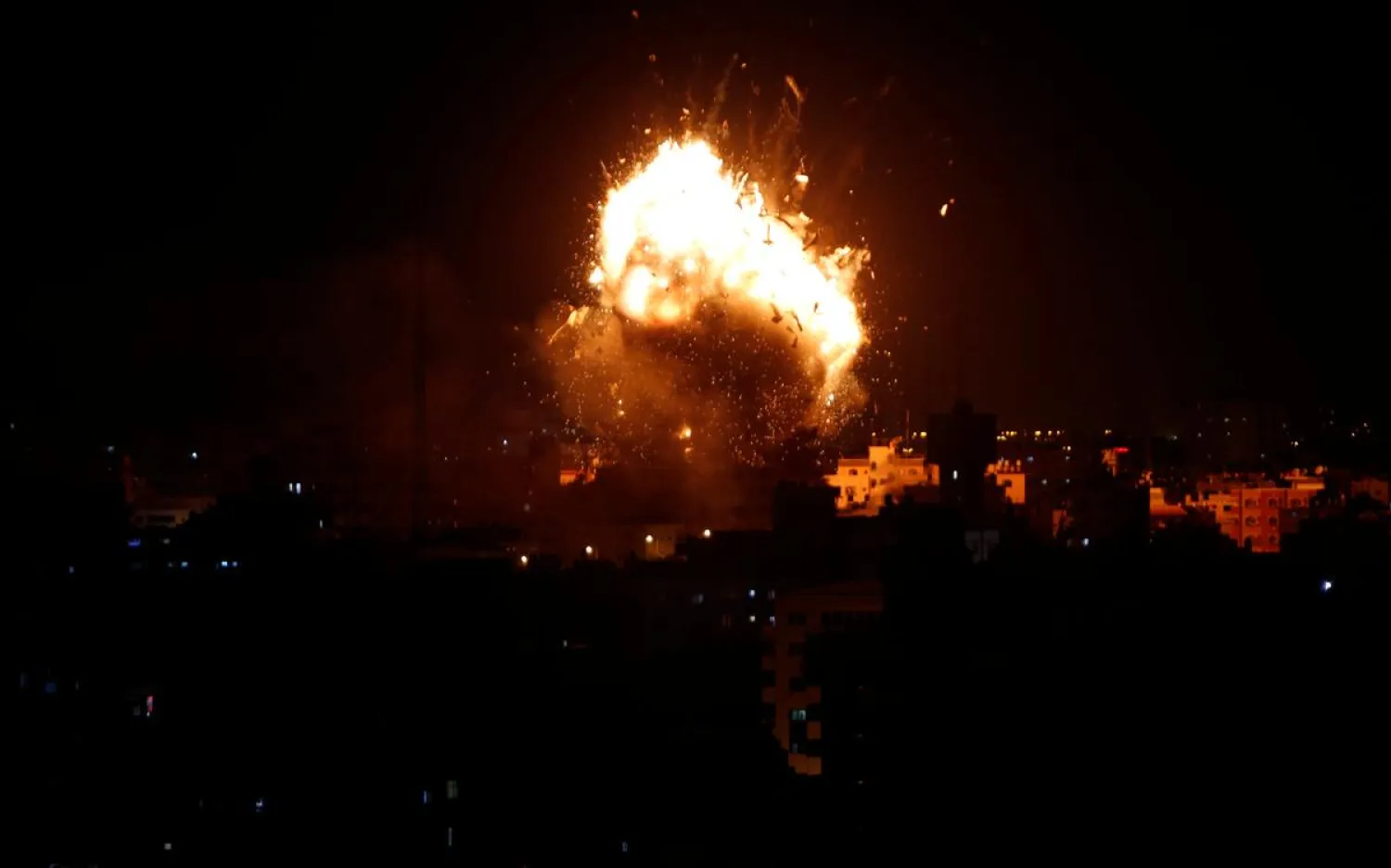 An explosion is seen during an Israeli air strike on Hamas' television station, in Gaza City November 12, 2018. REUTERS/Ahmed Zakot